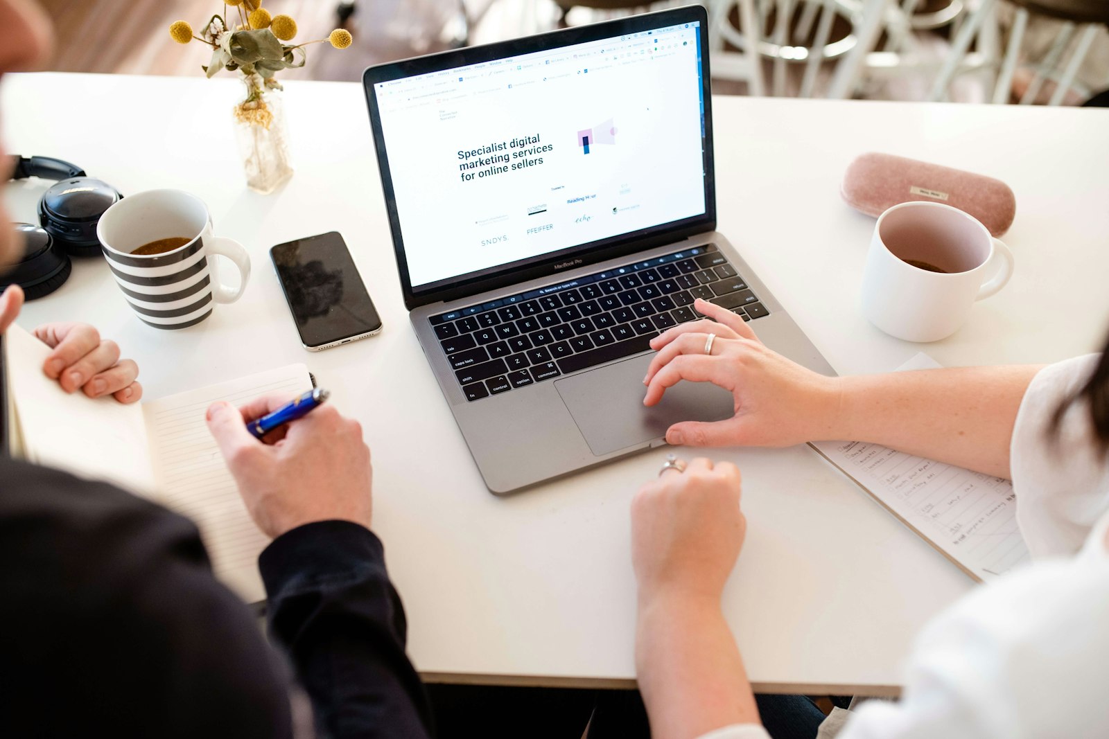 A counsellor updating secure client records on a laptop, a practical example of POPIA for practitioners